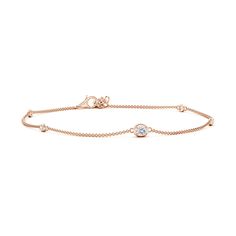 The oval diamond is accompanied by bezel-set station round diamonds on this simple and elegant 14k rose gold bracelet. It is framed by a polished metal rim that elevates the bracelet's minimalistic allure. Rose Gold Diamond Bracelet With Bezel Setting For Anniversary, Rose Gold Diamond Bracelet With Bezel Setting, Elegant Oval Bracelets With Bezel Setting, Elegant Rose Gold Bracelet With Bezel Setting, Elegant Rose Gold Bracelets With Bezel Setting, Classic Rose Gold Bracelet With Single Diamond, 14k Rose Gold Bracelet, Station Bracelet, Rose Gold Bracelet