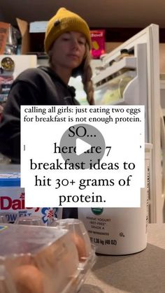 a person sitting at a counter with some food in front of them and a sign that says so here breakfast ideas to hit 30 + grains of protein