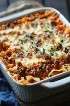 a casserole dish filled with meat and cheese