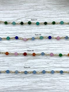 Are you looking for a unique way to add a splash of color to your jewelry designs? Our Colorful Stone Beaded Rosary Chains are the perfect way to do just that! Each chain is made with 4.5mm stone beads on gold wire and comes in 4 different styles. Style #1 features mixed green stone beads, style #2 features green, pink, and blue stone beads, style #3 features pink, red, orange, green, and blue stone beads, and style #4 features light blue stone beads. Each chain is sold by the foot, so you can g Traditional Gemstone Beads Rosary For Healing, Adjustable Traditional Rosary With Gemstone Beads, Spiritual Turquoise Rosary With Round Beads, Green Beaded Rosary With Round Beads, Adjustable Green Rosary With Round Beads, Hand Knotted Pearls, Rosary Chain, Brass Charms, Gold Wire