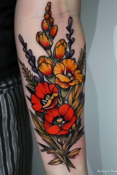 a woman's leg with flowers on it