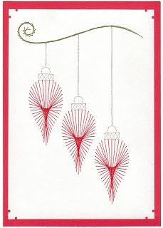 three red ornaments hanging from a string on a white background with the word happy new year written below them