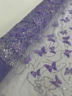 Beaded Fabric The beautiful design includes embroidered 3D butterfly patterns with shiny sequins. This lace can be used for dresses, tablecloths, nightgowns, prom gowns, bridesmaid gowns, wedding gowns, table covers/runners, pillows, home /event decorations, and much more. Available in Multiple Colors If you purchase more than one yard, we will send you the fabric in one piece. Details 100% Polyester Length: 30-54 inches Please Note: *The digital images we display have the most accurate color po Purple Embroidered Fabric For Wedding, Purple Organza Tulle Fabric For Wedding, Purple Floral Embroidered Fabric For Wedding, Purple Embroidered Organza Fabric For Party, Silver Embellished Embroidered Fabric For Reception, Beaded Organza Embroidered Fabric For Wedding, Purple Embroidered Organza Fabric For Wedding, Purple Organza Embroidered Fabric For Wedding, Embellished Sequin Organza Fabric For Wedding