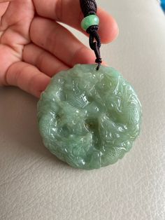 🌈 Chinese 9 Dragons Jadeite Pendant, Round Shape in Green 🌷 Untreated Natural Jadeite/ Grade A Jade 🌷 Certified : YES 🌷 Jade from Myanmar/ Burma 🌷 100% handmade carving 🌷 Chinese 9 Dragons 🌷 Dimensions : 53.8 x 53.8 x 13 mm 🌷 Color : Green 🌷 Free standard shipping from Hong Kong with tracking included 🌷 Take approximately 7-21 days to arrive worldwide 🔥 Recommended items look similar: 👍 https://www.etsy.com/listing/727799025 ❤️ In Chinese Culture: Young people wear jade pendant will Green Carved Amulet Necklace, Green Carved Healing Necklace, Healing Green Carved Necklace, Healing Green Carved Necklaces, Carved Green Round Jewelry, Green Carved Round Jewelry, Green Carved Necklaces For Healing, Handmade Green Emerald Necklace With Round Pendant, Green Amulet Round Necklace