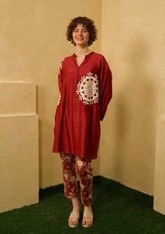 An anti-fit kurta featuring h applique work. This is paired with printed straight pants. This comes as a set of 2. The kurta comes with a slip. Length of kurta- 38"Pants- 37" Fabric: Kurta- chanderiPants- Cotton Colour: Red Embroidery details: Hand embroidery No.of components: 1 Delivery time: 15-20 days Washing Instructions: DRY CLEAN ONLY Straight Kurta Pant Set With Printed Motifs For Navratri, Festive Block Print Pant Set For Eid, Eid Festive Block Print Pant Set, Casual Block Print Kurta For Eid, Cotton Pant Set For Designer Wear At Festivals, Cotton Sets With Chikankari Embroidery Tunic, Eid Palazzo Set With Printed Motifs And Straight Pants, Eid Palazzo Set With Printed Motifs, Designer Cotton Pant Set For Eid