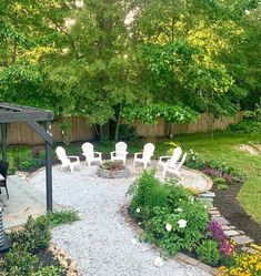 an outdoor patio area with chairs and gravel