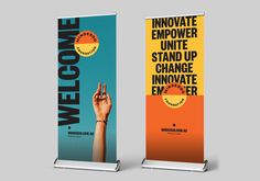 two roll up banners with the words welcome to me and an image of someone holding their hand up