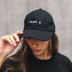 Black, 100% cotton dad hat; Lane 8 artwork embroidered on front. Extra low profile. Adjustable, antique brass buckle closure. Matching undervisor. Unstructured for classic, elegant style. One size fits most. Porter Robinson, Classic Elegant Style, William Black, Adventure Club, Black Tigers, Popular Artists, Black Bracelets, Classic Elegant, Brass Buckle