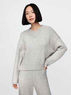 Supersoft cotton-blend sweater.  V-neck.  Long sleeves with drop shoulders.  Ribbed hem.  Fit: Over Grey V Neck Sweater Outfit, Plush Yarn, Everyday Luxury, Everyday Luxuries, Toddler Gifts, V Neck Sweater, New Woman, Vneck Sweater, Drop Shoulder