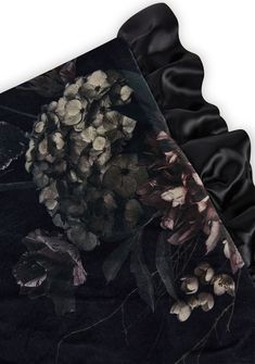 a black scarf with flowers and leaves on it