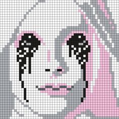 a cross stitch pattern with a woman's face