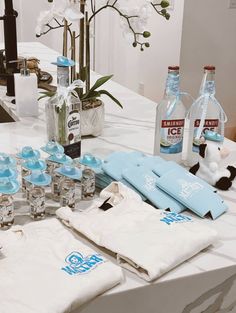 the table is set up with bottles and napkins