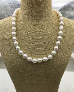 "pearl jewelry: pearl necklace Quantity: 1 pc necklace length: 17 inches pearl size: around 10mm--width pearl body: AA+ pearl grade: AA+ pearl luster: high pearl shape: rice pearl color: white Back to Other Jewelry Section 01: \"Tahitian,Akoya,Sea Pearl\" Section: https://www.etsy.com/shop/WenPearls?section_id=15806339 02: \"Potato/Near Round Pearl\" Section: https://www.etsy.com/shop/WenPearls?section_id=16378067 03: \"Round Pearl\" Section: https://www.etsy.com/shop/WenPearls?section_id=161632 White Oval Pearl Pendant Necklace, White Pearl Drop Oval Necklace, White Oval Pearl Drop Necklace, Classic White Baroque Pearl Necklace, Classic White Pear-shaped Necklace, Rice Pearl Necklace, Leather Pearl Jewelry, Jewelry Pearl Necklace, Big Pearl