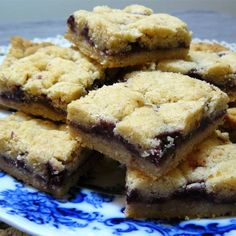 a blue and white plate topped with cookies