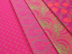 pink and green fabric with different patterns on it, including paisley print in the center