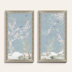 two framed paintings with flowers and birds in the sky, one is blue and the other is white