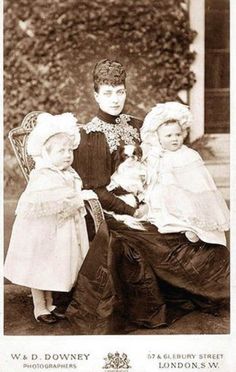 an old black and white photo of three children