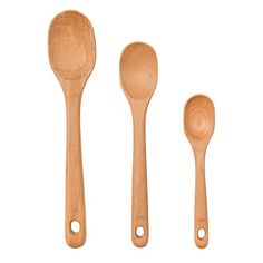 three wooden spoons, one with holes in the middle