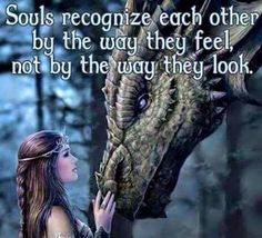 a woman is touching a dragon's head with her hand and the words, souls recognize each other by the way they feel not by the way they look