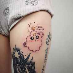 a woman's thigh with a small pink bear tattoo on her left leg and the words born to princess written below it