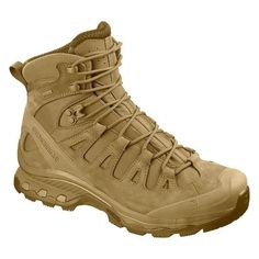 a pair of tan hiking boots on a white background