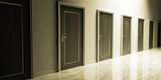 a row of doors in an empty room