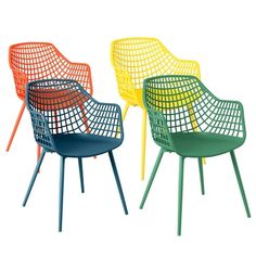 four different colored chairs sitting next to each other