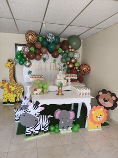 an animal themed birthday party with balloons and decorations