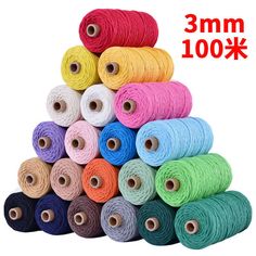 several spools of thread are stacked on top of each other in different colors