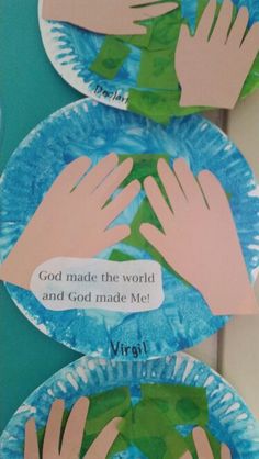 two paper plates with hands on them that say god made the world and god made me