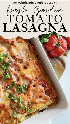 a casserole dish with tomatoes and cheese on top, in a white baking dish