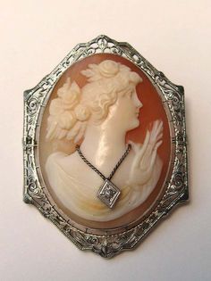 For Sale on 1stDibs - Lovely 14k White Gold Carved Cameo Brooch Depicting a lovely lady with a wonderful diamond necklace. It measures 1.82 in. top to bottom x 1.34 in. wide. Classic Cameo Brooches For Wedding, Elegant Medallion Brooch For Collectors, Elegant Medallion Brooch For Formal Occasions, Oval Brooches For Formal Occasions, Formal Brooches With Diamond Accents, Ornate Cameo Brooch For Anniversary, Cameo Pendant Brooch For Wedding, Cameo Pendant Brooches For Wedding, Ornate Cameo Brooches For Anniversary