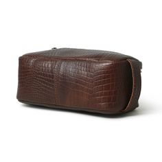 This Genuine Leather Toiletry bag is designed to be practical with its unique design without sacrificing quality and style. It is an eye-catcher with its combination of classy and durable leather and its beautiful pattern. You can carry your items such as your small electronics, cash, keys, tools, and a multitude of other small travel items, the bag also doubles as a toiletry bag for your cosmetics, jewelry, and toiletries. Salient Features Color: Dark Brown Materials: Full-grain buffalo Leather Brown Leather Cosmetic Bag, Brown Travel Bag With Leather Trim For On-the-go, Functional Leather Cosmetic Bag For On-the-go, Men’s Toiletry Bag, Leather Dopp Kit, Leather Toiletry Bag, Dopp Kit, Travel Items, Natural Tan