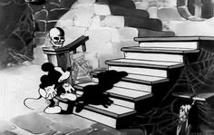 the mickey mouse cartoon is standing on some stairs