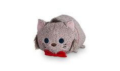 a small gray stuffed animal with a red bow around it's neck and eyes