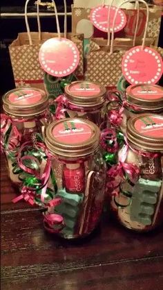 mason jars filled with pink and green decorations