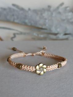 a bracelet with a flower on it