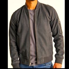 Classic Bomber Jacket In A Genuine Suede With Full-Zip Closure, Ribbed Hem And Cuffs, Side Pockets And Zipper Pocket At Sleeve. Lining: 55% Polyester, 45% Viscose Pocket Filling: 100% Polyester Fibers Shell: 100% Lamb Suede Classic Biker Jacket With Ribbed Cuffs For Fall, Classic Fall Biker Jacket With Ribbed Cuffs, Classic Fall Outerwear With Zip Cuffs, Casual Leather Jacket With Zip Cuffs, Abercrombie Men, Varsity Jacket Men, Tan Jacket, Aviator Jackets, Line Jackets