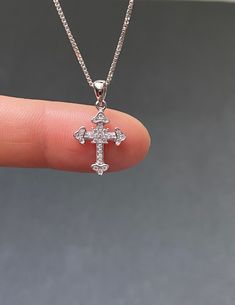 "Tiny Sterling Silver Cross CZ Necklace Minimalist and Dainty Metal: All components are made from solid .925 Sterling Silver Stone: Cubic Zirconia Measurement: pendant height is 21mm (0.83\") and 12mm (0.47\") wide Choose Chain Length At Checkout You can find other cross jewelry in my shop here https://www.etsy.com/shop/LinksAndStones?ref=seller-platform-mcnav&section_id=24376960 Please feel free to Convo me with any questions before purchasing. Please view policy before purchasing Thank You Silver Sterling Silver Cross Necklace With Diamond Cut, Sterling Silver Diamond Cut Silver Cross Necklace, Classic Diamond White Cross Necklace For Gifts, Diamond White Sterling Silver Cross Necklace For Gift, Classic Cubic Zirconia Cross Necklace For Gift, Gift Diamond White Sterling Silver Cross Necklace, Classic Cubic Zirconia Cross Necklace As Gift, Diamond White Sterling Silver Cross Necklace As Gift, Tiny Cross Necklace