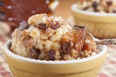 a close up of a bowl of food with raisins and nuts on top