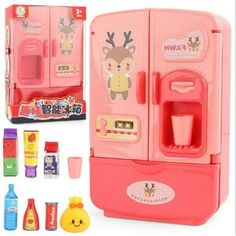 a pink toy refrigerator with drinks and snacks in it's display case next to other toys