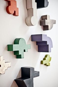 the wall is decorated with different shapes and sizes