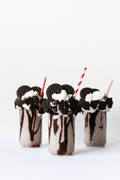 three glasses filled with ice cream and oreo cookies