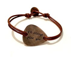 "Make the perfect personalized gift for the musician or music lover in your life. Hand stamped inspirational bracelet that carries messages, words, symbols, quotes and sayings to inspire, motivate and encourage the wearer. Metal - Copper Guitar Pick - The size and shape is of a standard guitar pick hand cut with my saw from 18ga metal sheet. Engraving - Hand stamped with up to 30 characters on each side. Leather - Double 2.2mm genuine leather with button clasp. Finish - Oxidized. Size - To find Adjustable Bracelets For Father's Day Gift, Adjustable Bracelets As Father's Day Gift, Adjustable Hand-stamped Bracelet For Valentine's Day, Adjustable Hand Stamped Bracelet For Valentine's Day, Adjustable Jewelry For Father's Day Personalized Gift, Valentine's Day Adjustable Hand Stamped Bracelets, Valentine's Day Adjustable Hand-stamped Bracelet, Valentine's Day Adjustable Hand Stamped Bracelet, Adjustable Engraved Meaningful Bracelets