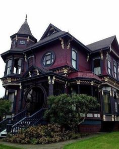 an old victorian style house with many windows