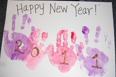 a handprinted new year card with two hands