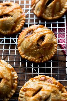 several small pies on a cooling rack