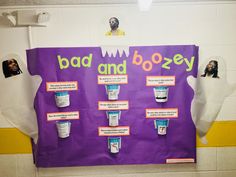 a bulletin board with different types of toothpaste on it in a school hallway