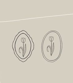 two flowers are in the middle of a circle with an oval border around it, and one flower is on top of another