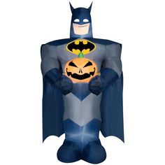 an inflatable batman costume is holding a pumpkin